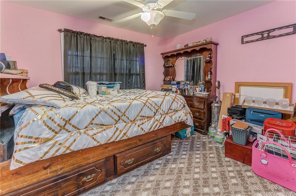1040 Old Dalton Road Northeast Rome, GA 30165 - Photo 9 of 20 a bedroom with a bed a dresser and window