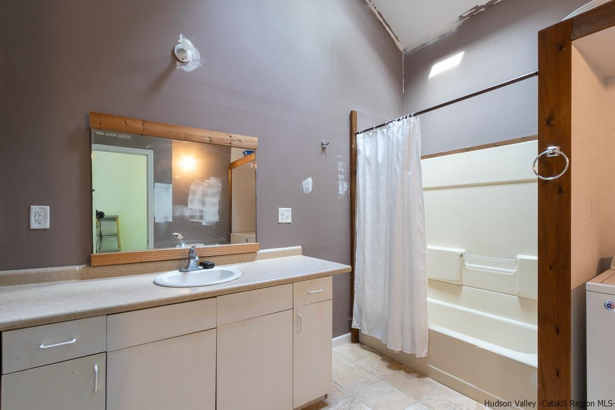 19 Dock Road Milton, NY 12547 - Photo 8 of 17 a bathroom with a double vanity sink mirror and shower