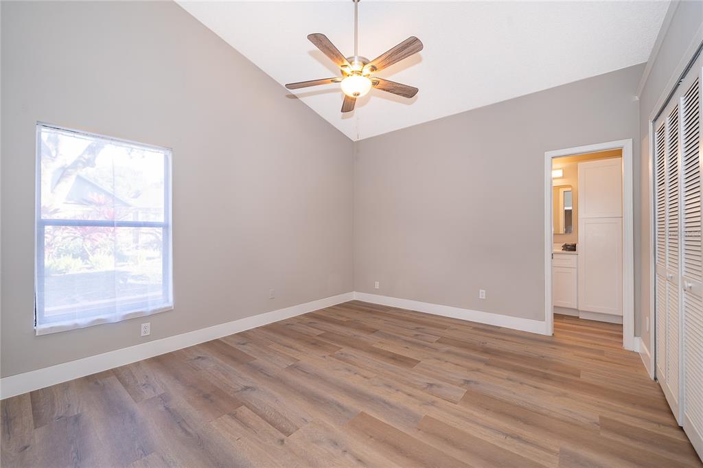 1652 Riveredge Road Oviedo, FL 32766 - Photo 12 of 22 wooden floor in an empty room with a window
