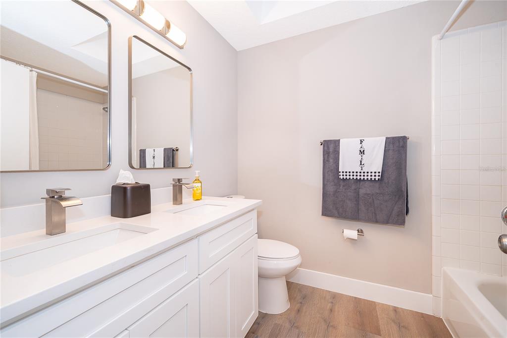 1652 Riveredge Road Oviedo, FL 32766 - Photo 16 of 22 a bathroom with a toilet sink and mirror