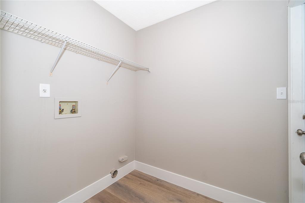 1652 Riveredge Road Oviedo, FL 32766 - Photo 18 of 22 a view of a room with racks on the wall