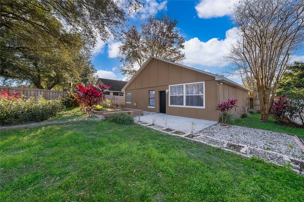 1652 Riveredge Road Oviedo, FL 32766 - Photo 20 of 22 a view of a house with a yard and tree s
