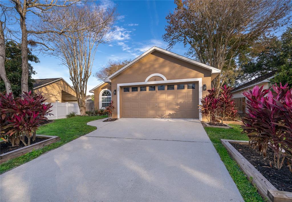 1652 Riveredge Road Oviedo, FL 32766 - Photo 2 of 22 a front view of a house with yard and green space
