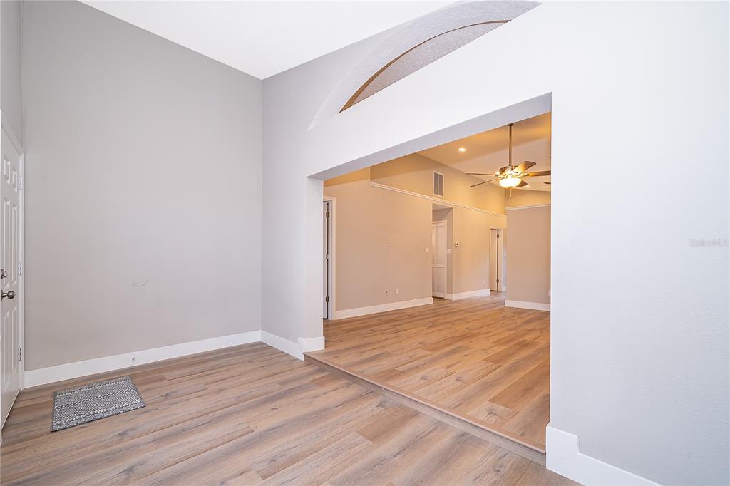 1652 Riveredge Road Oviedo, FL 32766 - Photo 10 of 22 a view of an empty room with wooden floor