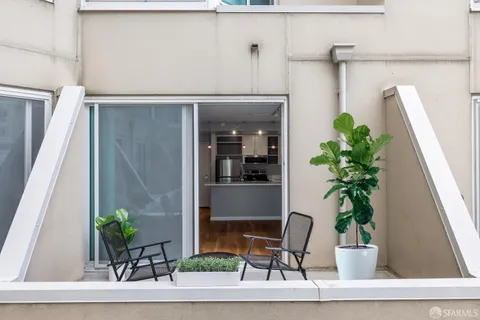 a potted plant sitting on the side of a building