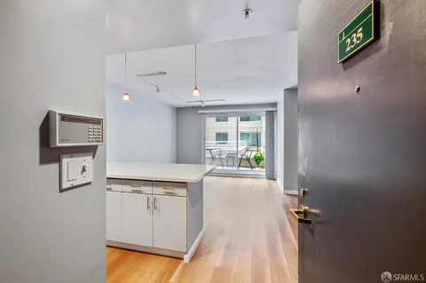 a view of a kitchen with electric appliances