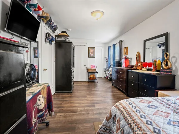 a bed room with a bed and a television