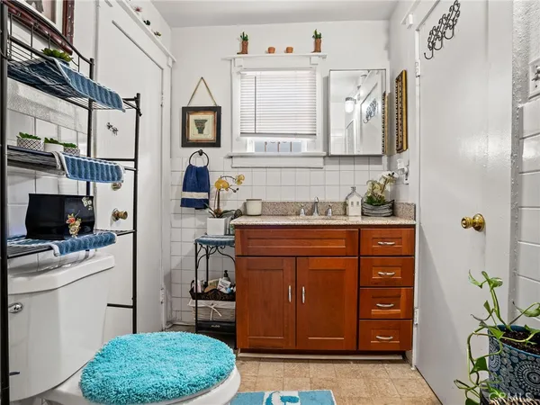 a bathroom with a toilet and a shower curtain