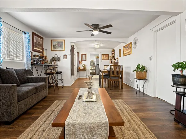 a living room with lots of furniture and a rug