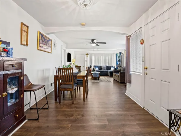 a view of a livingroom with furniture and a hardwood floor