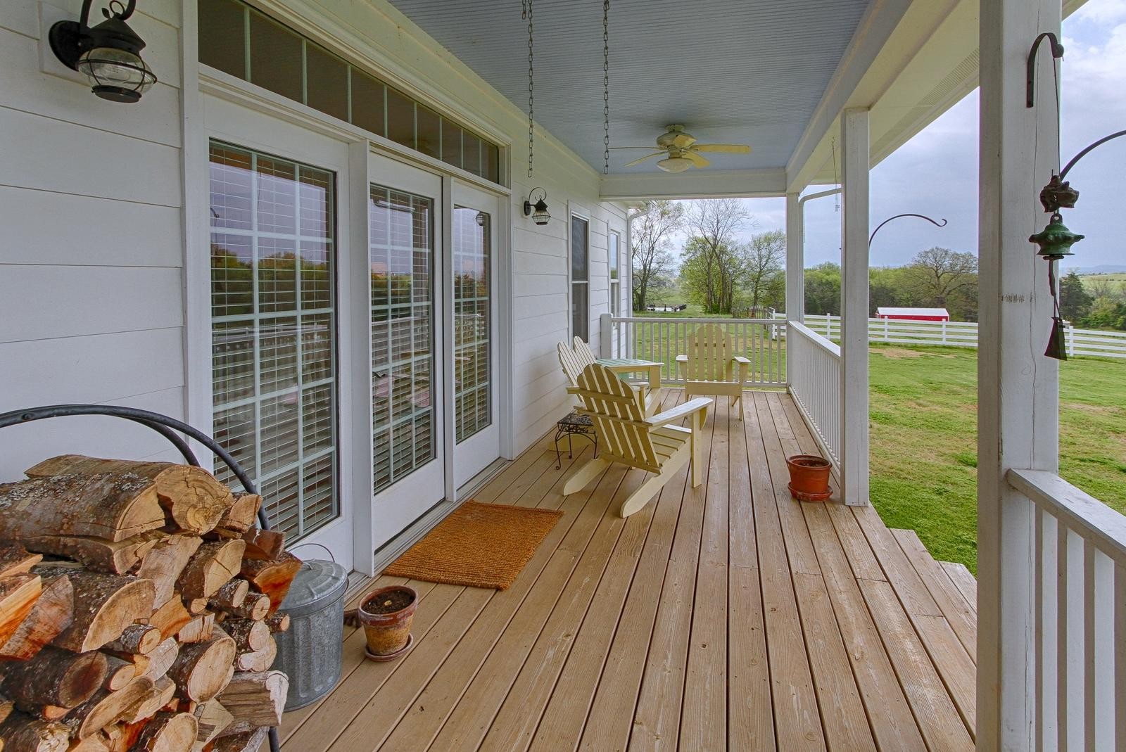 350 Cliff Top Road Blaine, TN 37709 - Photo 24 of 34 a balcony with wooden floor table and chairs