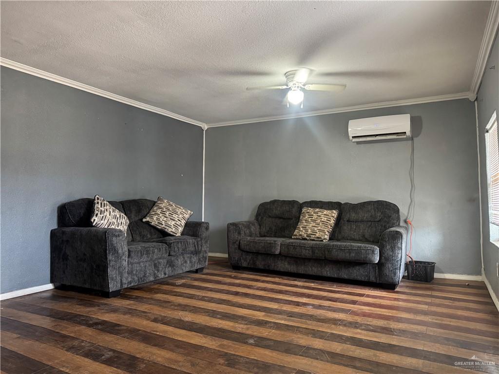 210 West Monte Cristo Road, Unit R Edinburg, TX 78541 - Photo 7 of 18 a living room with furniture and a wooden floor