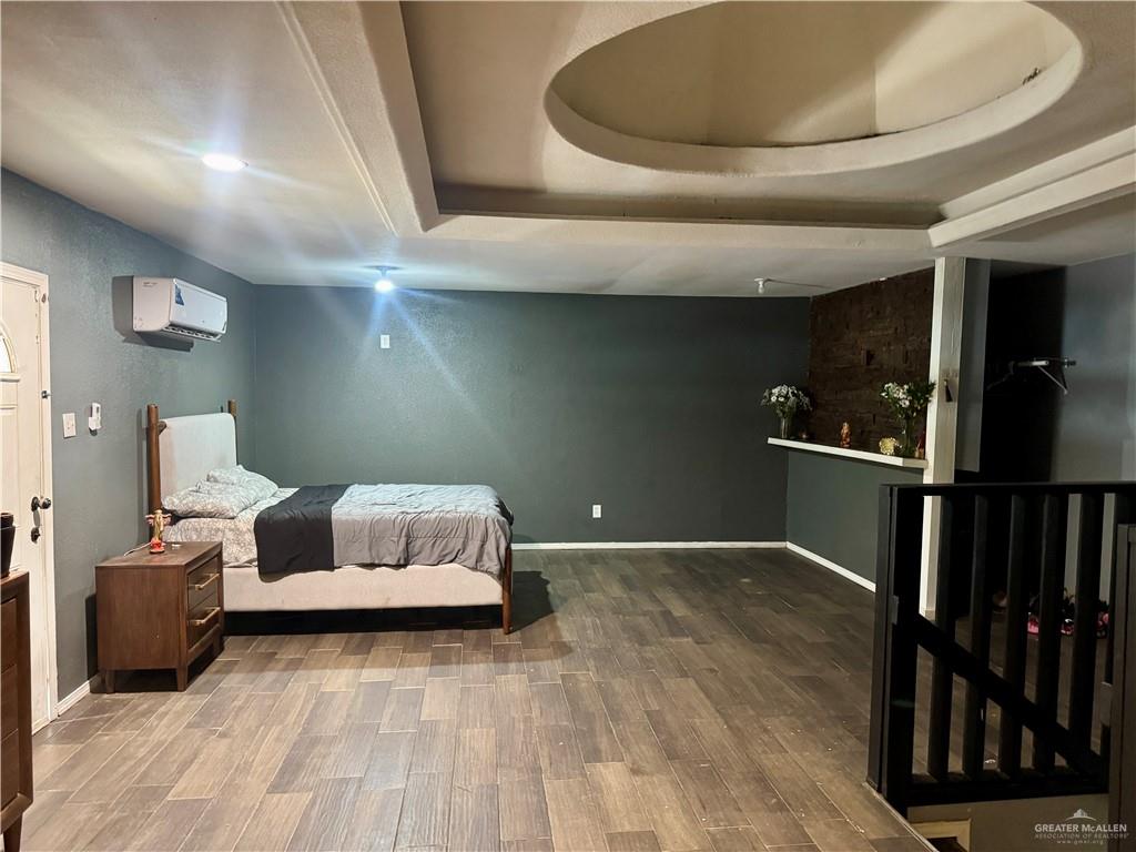 210 West Monte Cristo Road, Unit R Edinburg, TX 78541 - Photo 10 of 18 a living room with furniture and wooden floor
