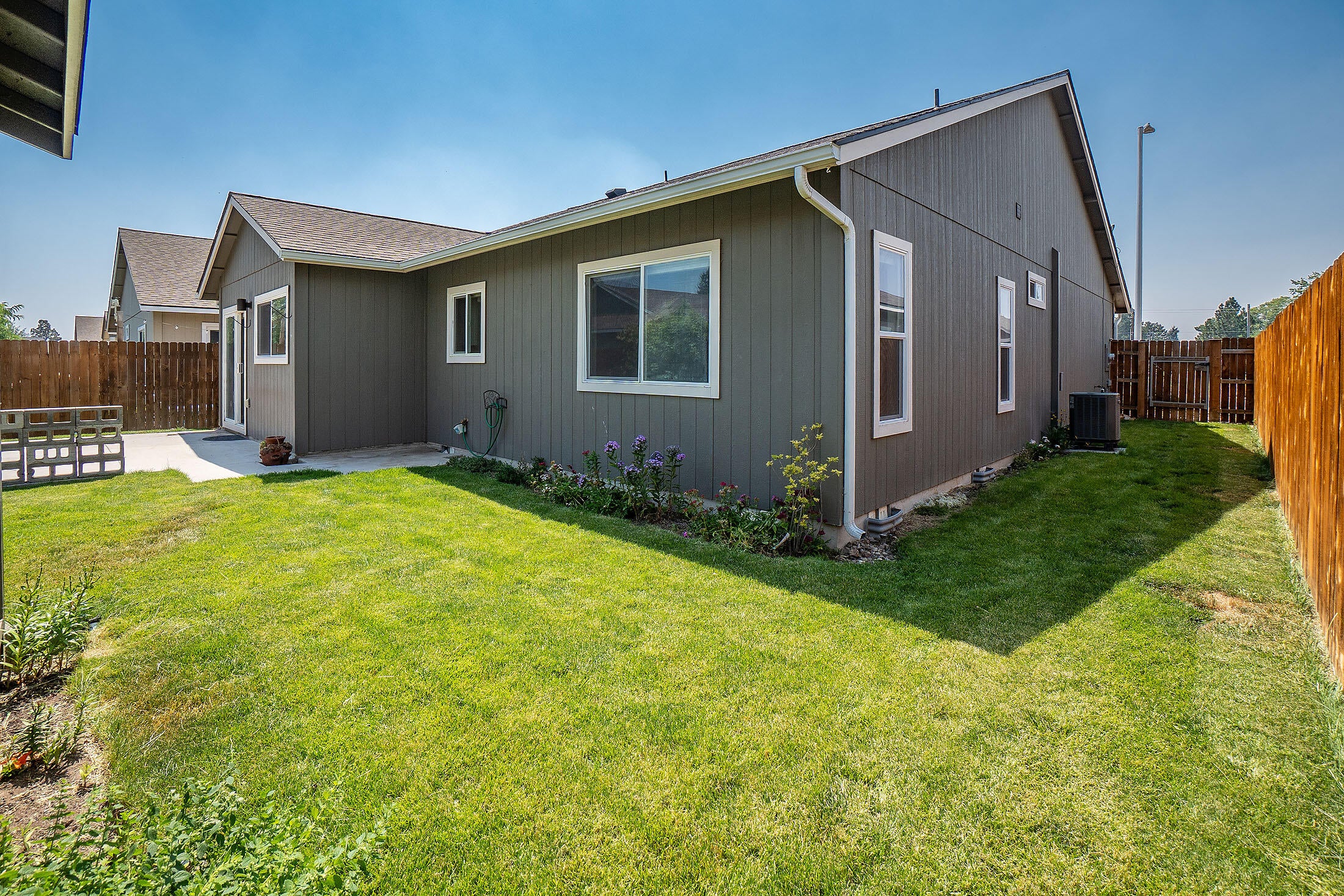 2586 Northeast Colleen Road Prineville, OR 97754 - Photo 3 of 29 This home features a fenced back yard with 2 gates, underground sprinklers, large patio, and generous garden shed. The rain gutters are already in place.