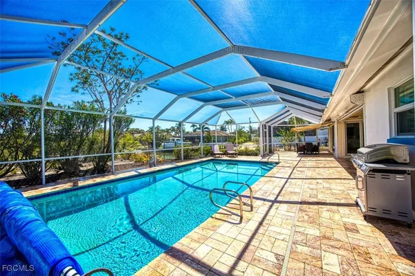 a view of a backyard with sitting area