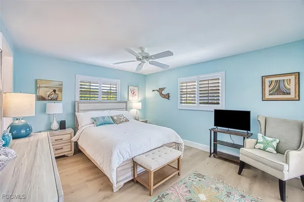 a bedroom with a bed and a couch