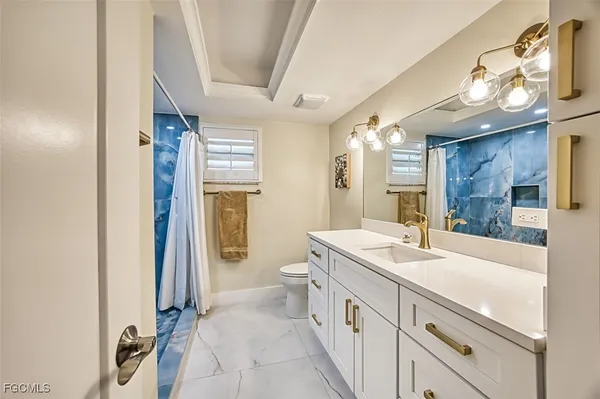 a bathroom with a sink a vanity and a mirror