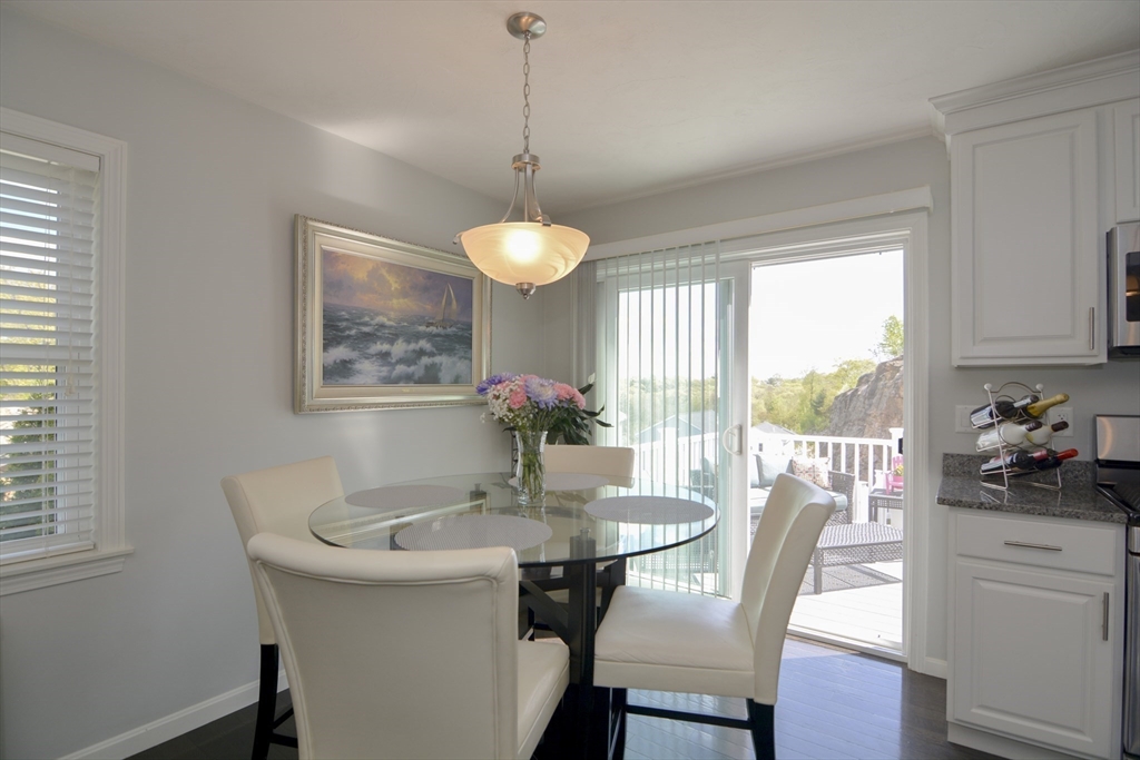 12 Gedney Drive Peabody, MA 01960 - Photo 11 of 41 a dining room with furniture a chandelier and wooden floor