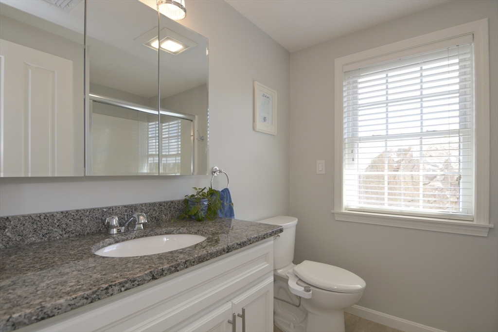12 Gedney Drive Peabody, MA 01960 - Photo 20 of 41 a bathroom with a granite countertop sink toilet and mirror