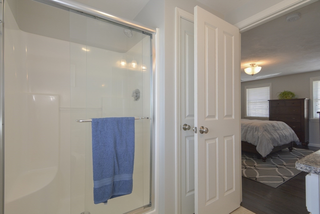 12 Gedney Drive Peabody, MA 01960 - Photo 21 of 41 a en suite bathroom with a sink and a mirror