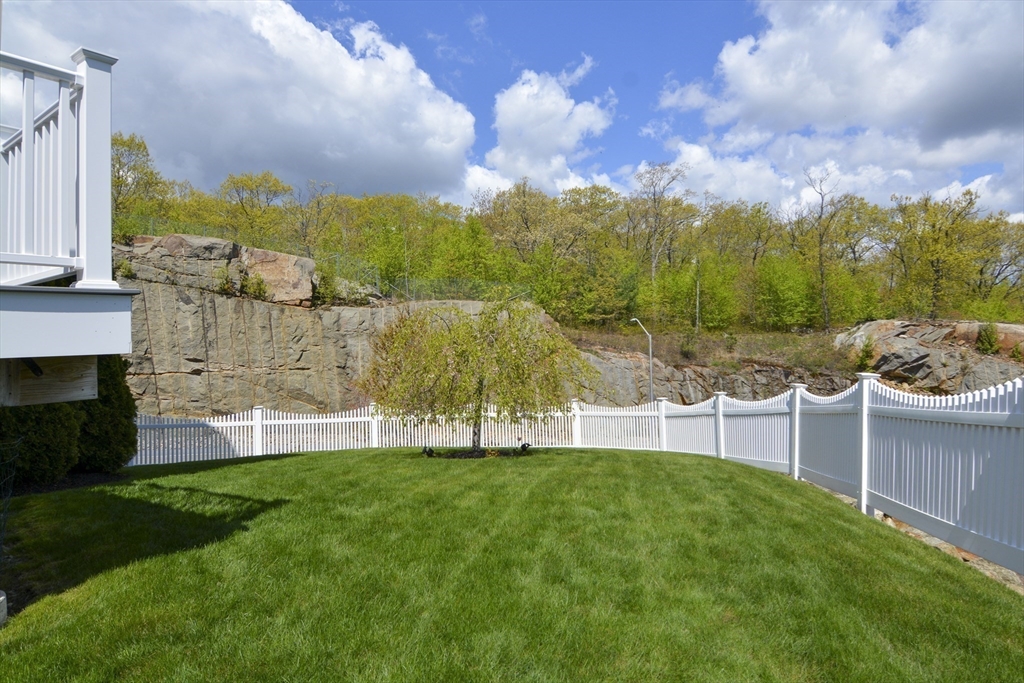 12 Gedney Drive Peabody, MA 01960 - Photo 36 of 41 a view of a garden with a building in the background