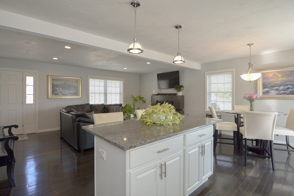 12 Gedney Drive Peabody, MA 01960 - Photo 8 of 41 a kitchen with stainless steel appliances granite countertop stove top oven and cabinets