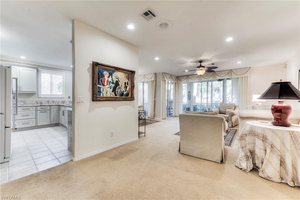 8471 Southbridge Drive, Unit 1 Estero, FL 33967 - Photo 13 of 37 a living room with furniture and a large window
