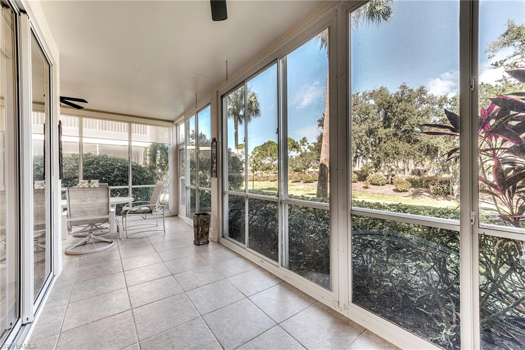 8471 Southbridge Drive, Unit 1 Estero, FL 33967 - Photo 14 of 37 a room with a large window and chairs