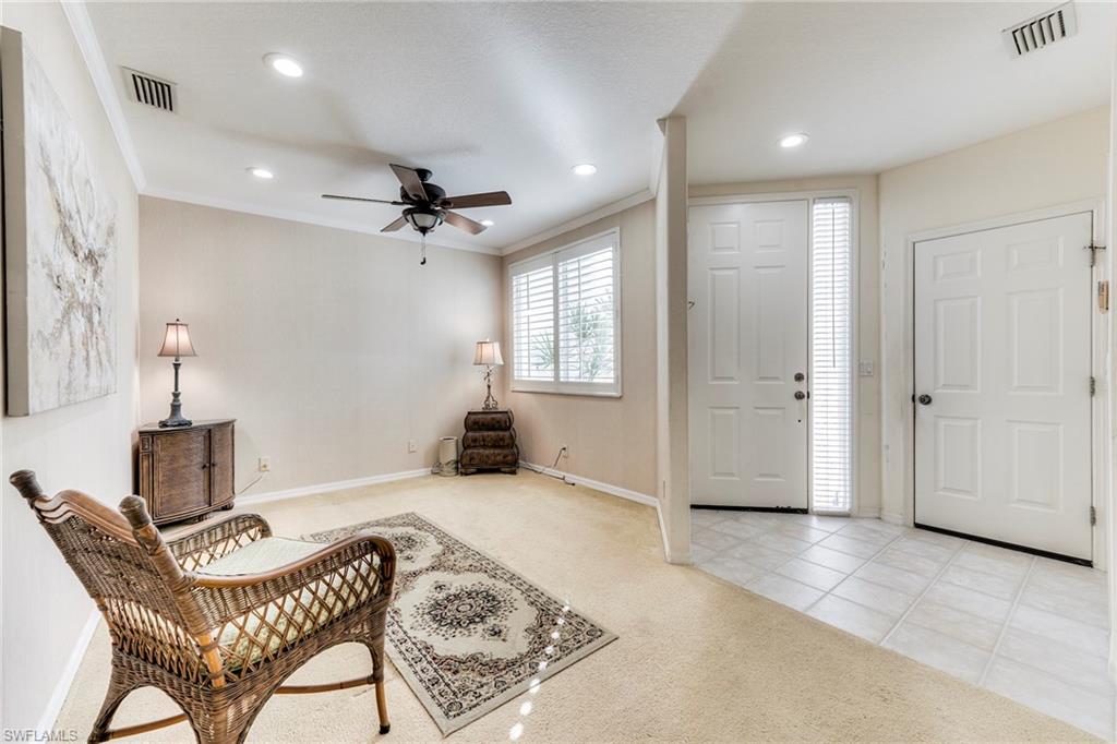 8471 Southbridge Drive, Unit 1 Estero, FL 33967 - Photo 17 of 37 a view of a livingroom with furniture and a ceiling fan