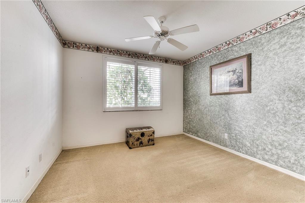 8471 Southbridge Drive, Unit 1 Estero, FL 33967 - Photo 18 of 37 an empty room with windows and fan