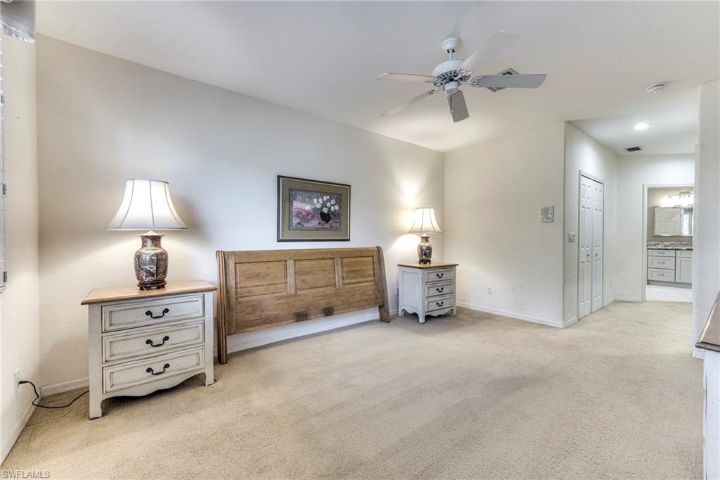 8471 Southbridge Drive, Unit 1 Estero, FL 33967 - Photo 22 of 37 a view of a room with furniture and a chandelier fan
