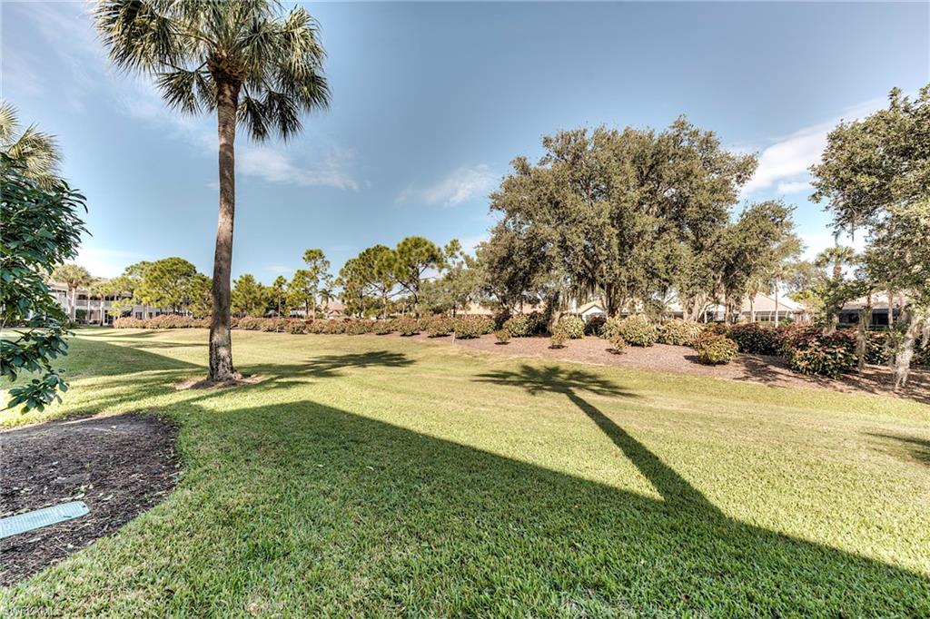 8471 Southbridge Drive, Unit 1 Estero, FL 33967 - Photo 26 of 37 a view of a yard with swimming pool