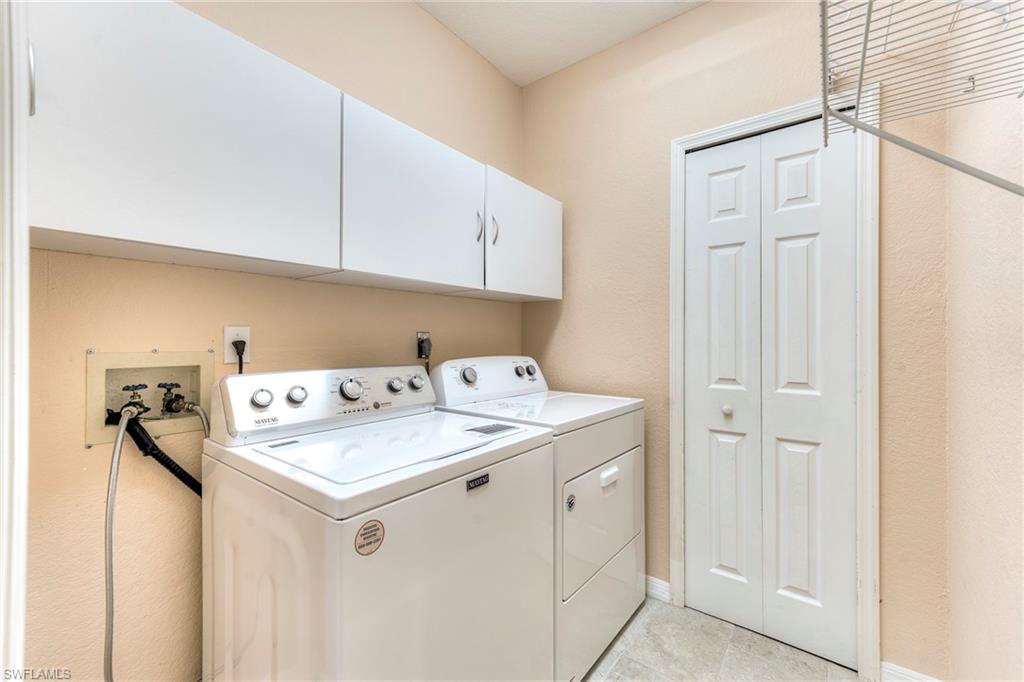 8471 Southbridge Drive, Unit 1 Estero, FL 33967 - Photo 27 of 37 a utility room with dryer and washer