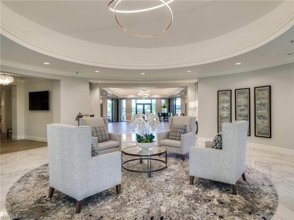 8471 Southbridge Drive, Unit 1 Estero, FL 33967 - Photo 36 of 37 a living room with couches and a flat screen tv