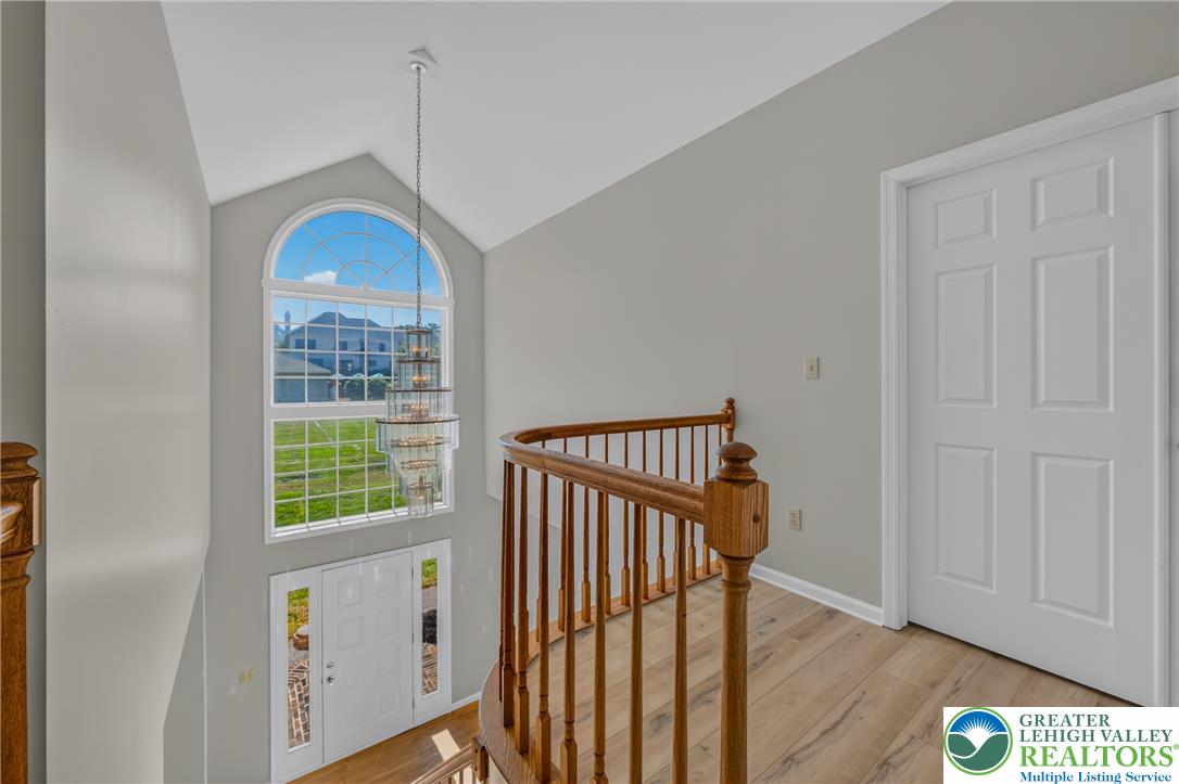 630 Clearfield Road Nazareth, PA 18064 - Photo 42 of 100 A spacious landing overlooking the entry foyer highlights high vaulted ceilings and a dramatic window.