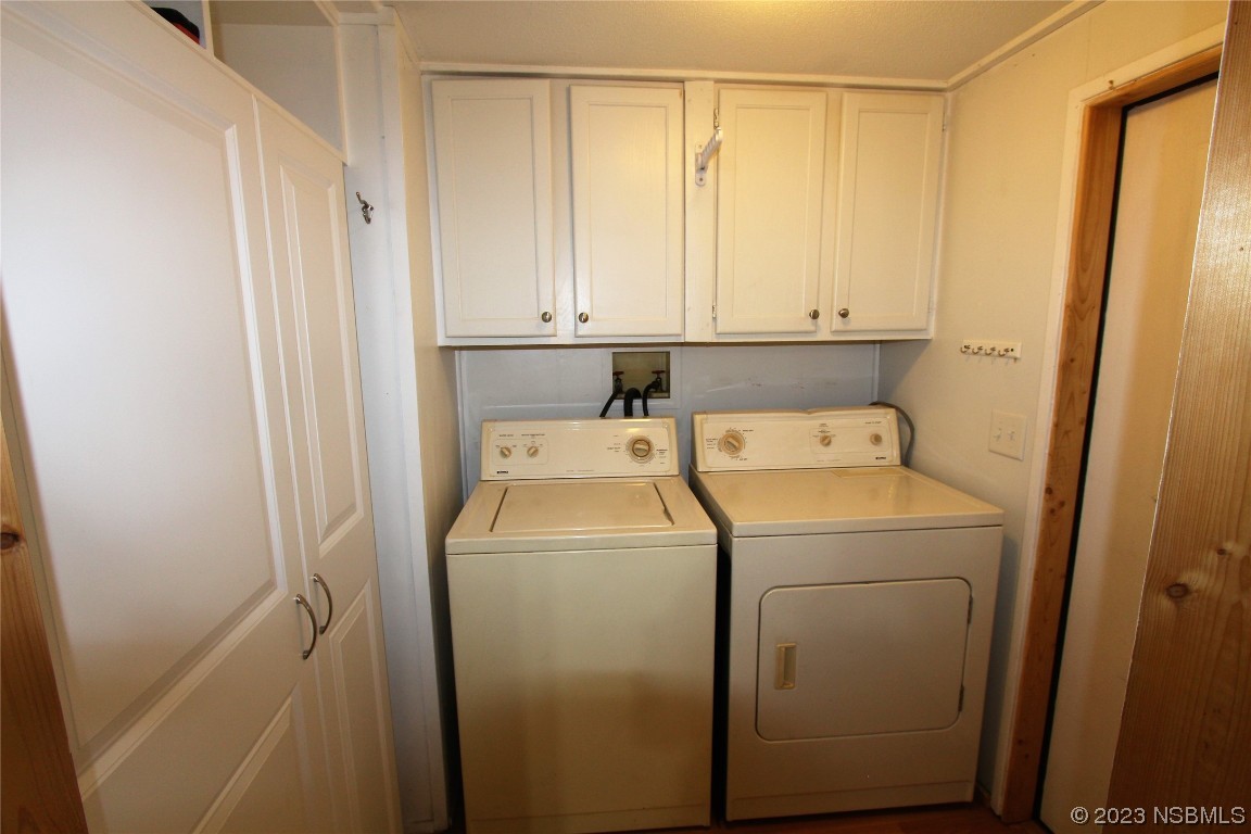 105 Oak Street Edgewater, FL 32141 - Photo 15 of 29 a view of storage and utility room with washer and dryer