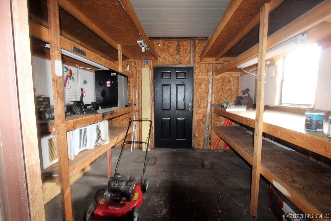 105 Oak Street Edgewater, FL 32141 - Photo 16 of 29 a view of a hallway with wooden floor and staircase