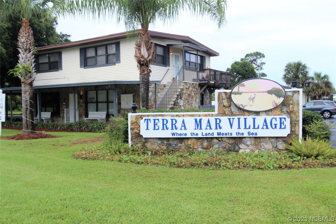 105 Oak Street Edgewater, FL 32141 - Photo 20 of 29 a sign that is sitting in front of a house