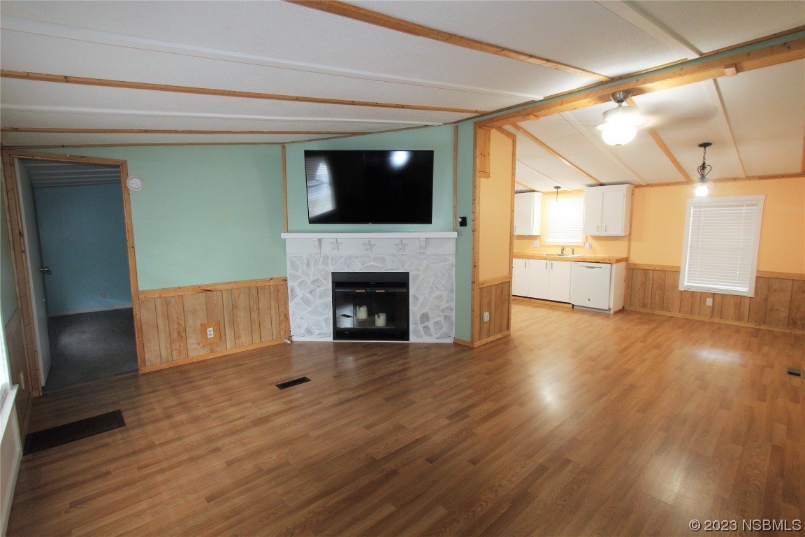 105 Oak Street Edgewater, FL 32141 - Photo 2 of 29 a view of a livingroom with an empty space and a fireplace