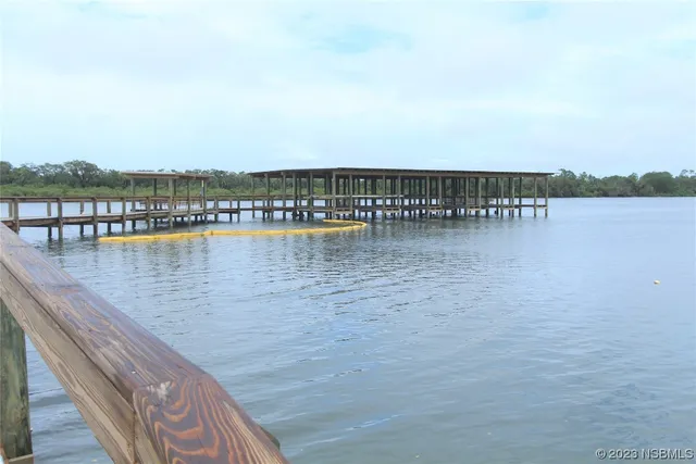 a view of house with backyard