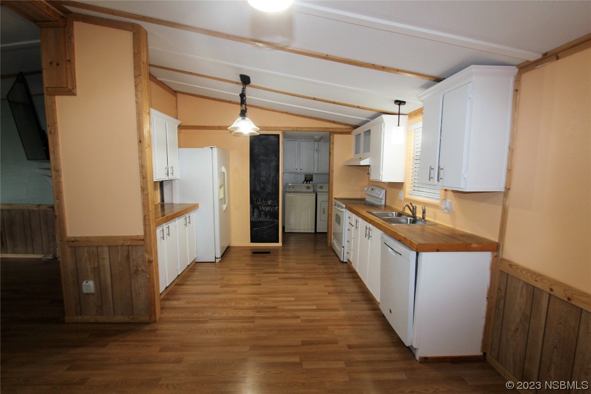 105 Oak Street Edgewater, FL 32141 - Photo 5 of 29 a view of a kitchen from the hallway
