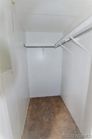 a view of a room with racks on the wall