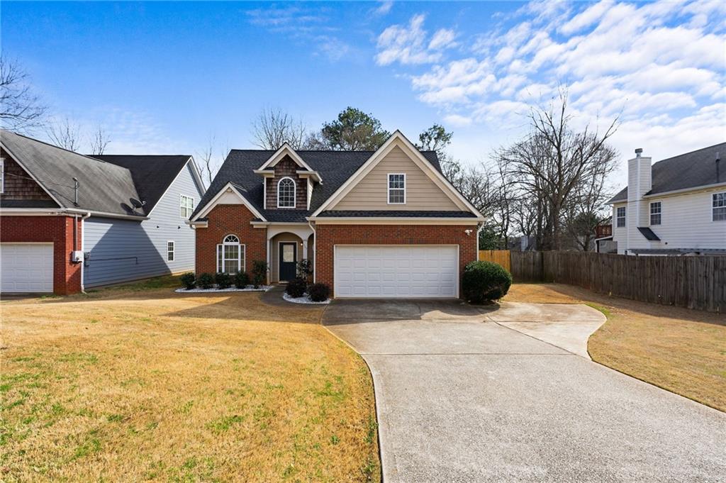293 Jordan Street Southeast Atlanta, GA 30315 - Photo 1 of 26 a front view of a house with a yard