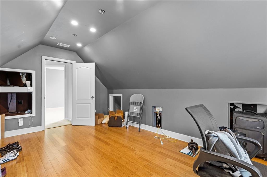 293 Jordan Street Southeast Atlanta, GA 30315 - Photo 14 of 26 a room with gym equipment and wooden floor