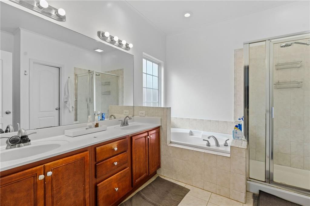 293 Jordan Street Southeast Atlanta, GA 30315 - Photo 20 of 26 a bathroom with a tub sink double and mirror