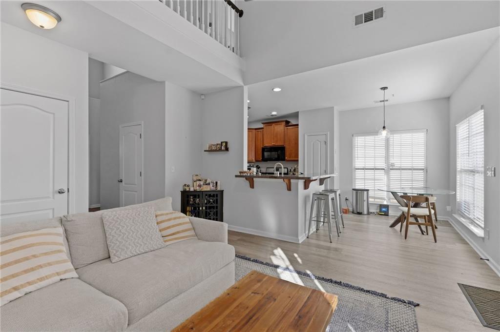 293 Jordan Street Southeast Atlanta, GA 30315 - Photo 5 of 26 a living room with furniture and a flat screen tv