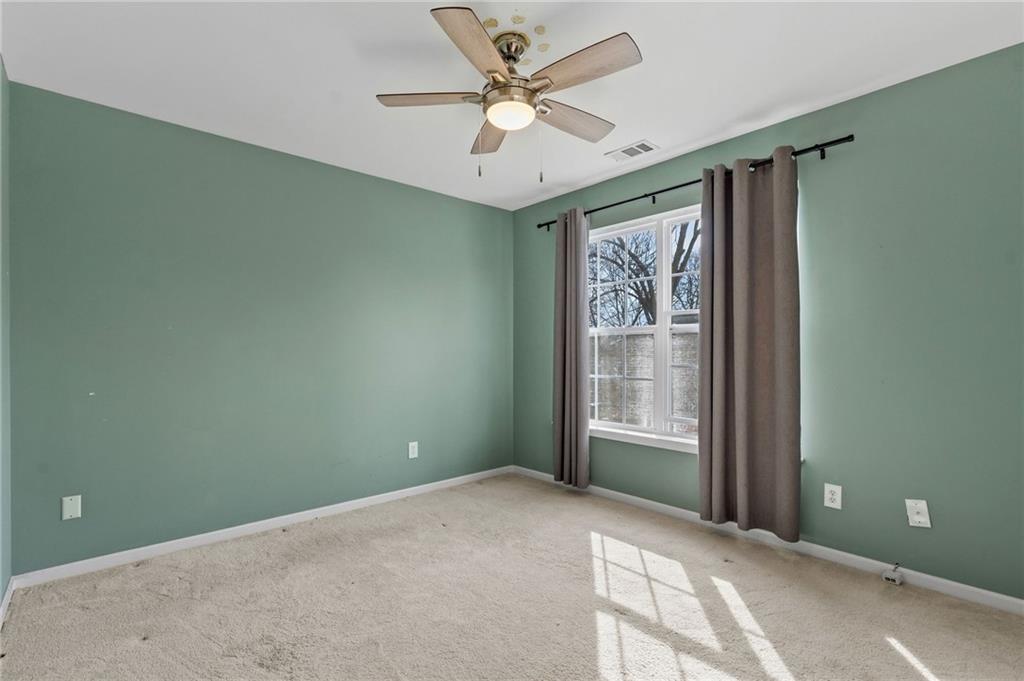 293 Jordan Street Southeast Atlanta, GA 30315 - Photo 10 of 26 a view of a livingroom with a ceiling fan and window