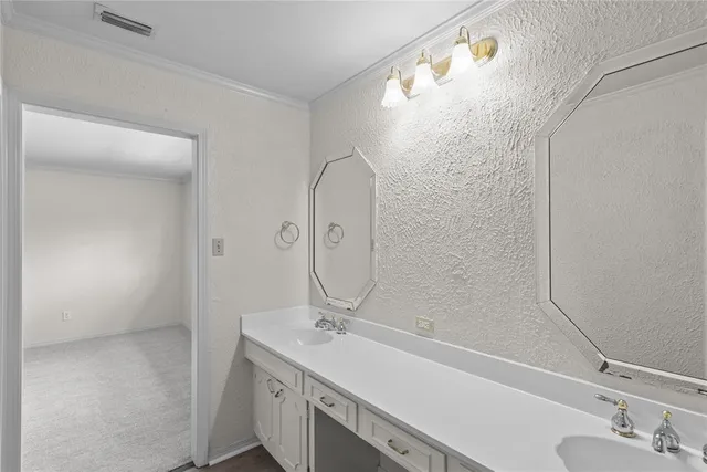 a bathroom with a sink and mirror