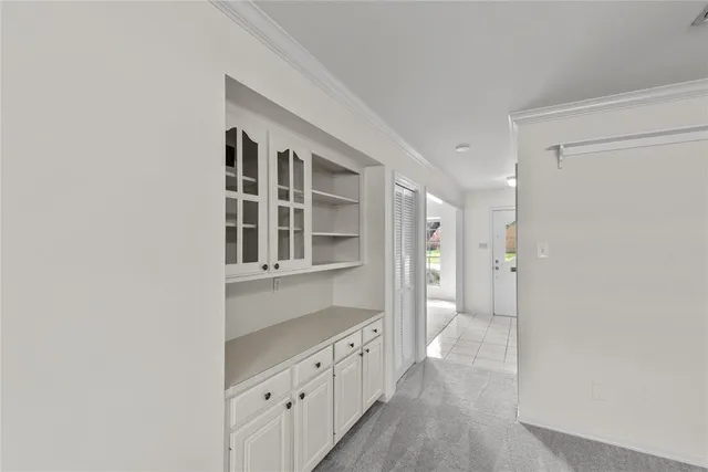 a bathroom with a double vanity sink and large mirror