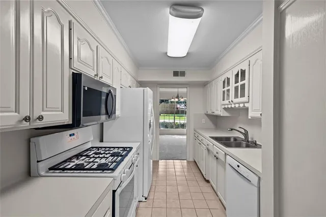a bathroom with a toilet sink vanity and mirror